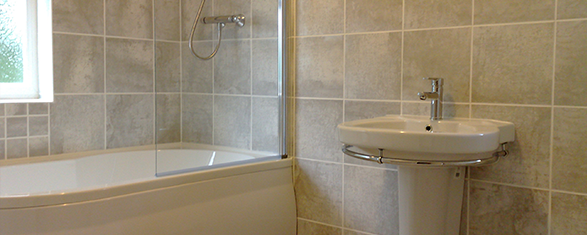 Bathroom with stone-look tiling